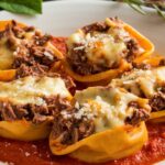 A creamy bowl of Cheesesteak Tortellini Delight featuring tender beef, colorful bell peppers, and cheese-filled tortellini.