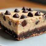 No-bake chocolate chip cookie dough bars with a smooth chocolate topping. Perfect for dessert lovers.