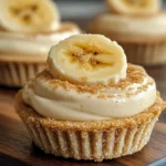 No-bake mini banana cream pies with graham cracker crust, banana slices, and whipped cream topping