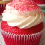 Delicious Strawberry Cheesecake Red Velvet Cupcakes with cream cheese frosting and fresh strawberries. Perfect for any occasion!