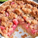 Homemade rhubarb sour cream pie with a golden crust and creamy filling, topped with a crunchy streusel.