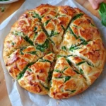 Spinach Artichoke Dip Pull-Apart Christmas Bread shaped like a Christmas tree, perfect for holiday gatherings and parties.