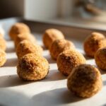 Close-up of several homemade hairball support cat treats on parchment paper.